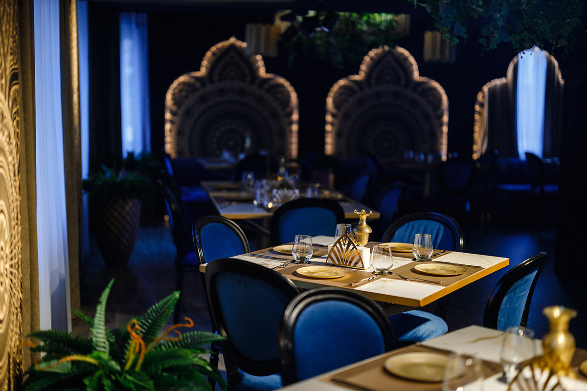 Modern interior decor for the restaurant in shades of gold and blue